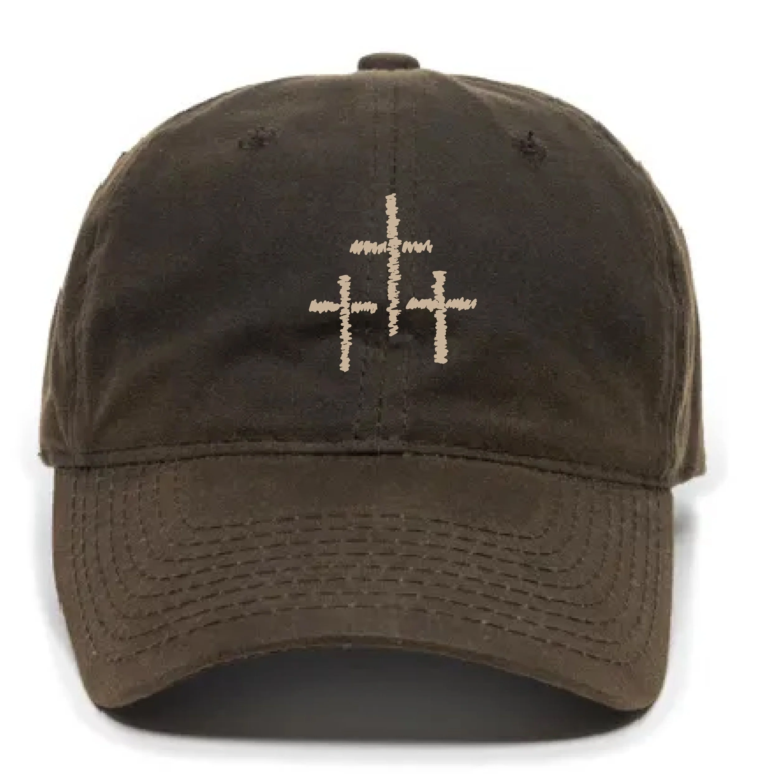 Close-up of a brown baseball cap with three vertical white stitched crosses in the center.