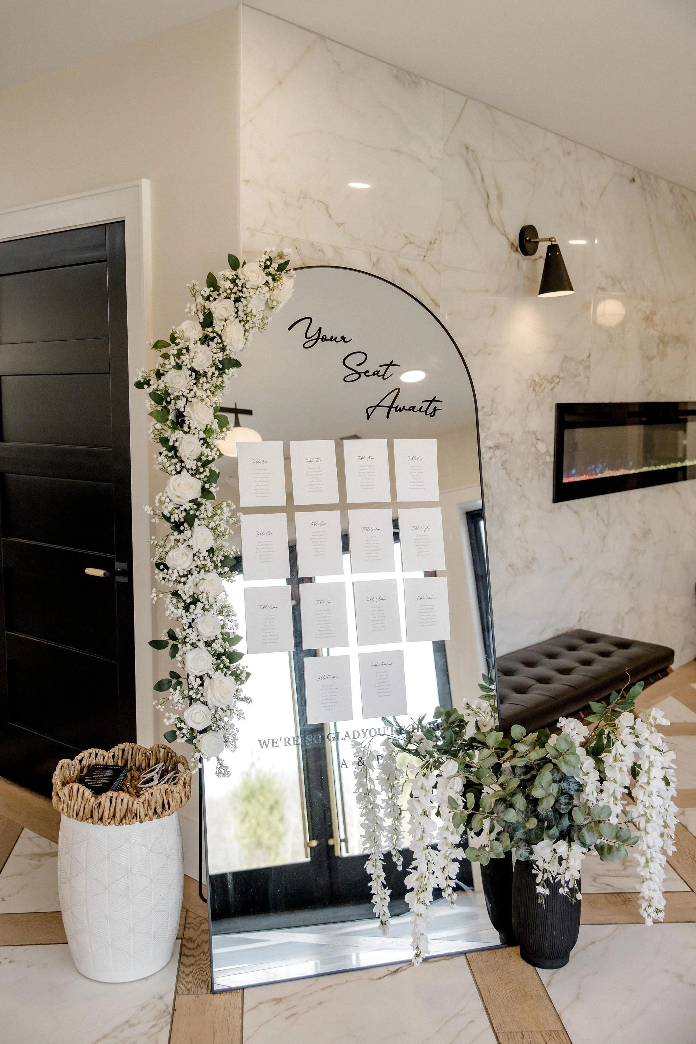 mirror seating chart with floral decor