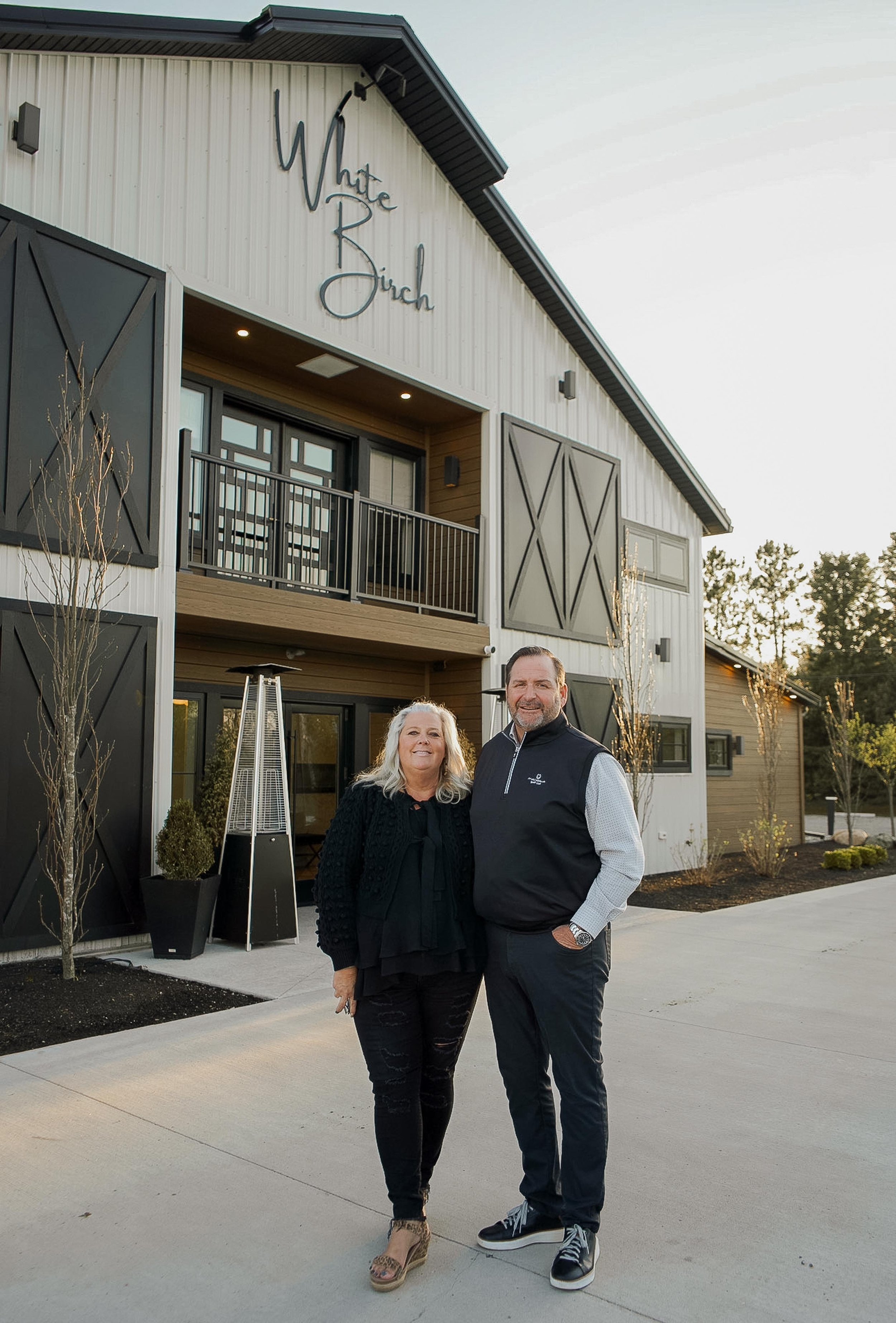 owners Pat & Amie standing in front of the barn