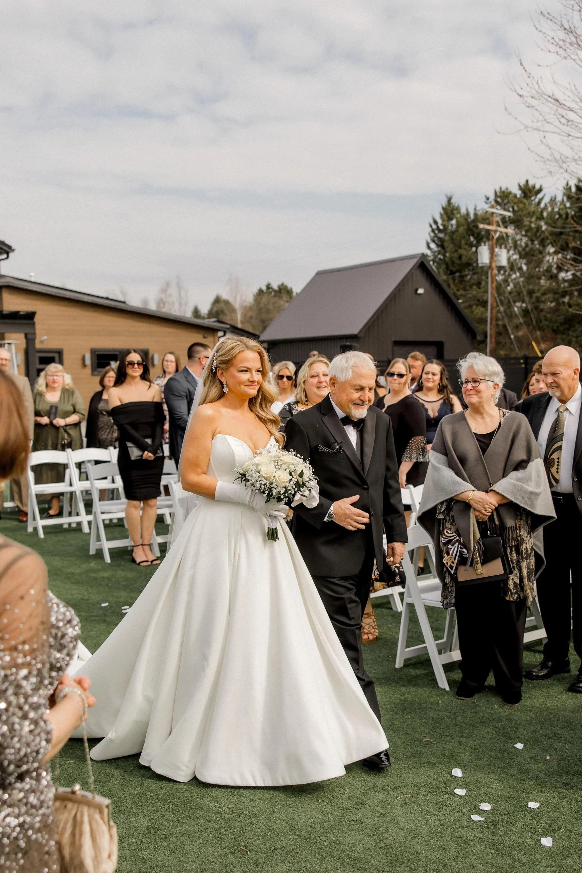 bride and her father walking down the aisle