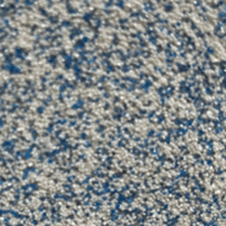 Close-up of a surface covered in tiny silver and blue glitter particles.