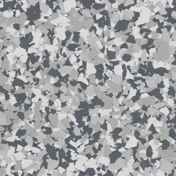 Close-up of speckled gray, white, and black terrazzo flooring.