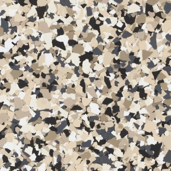 Close-up of multicolored speckled textured surface, resembling terrazzo flooring with black, white, beige, and gray chips.