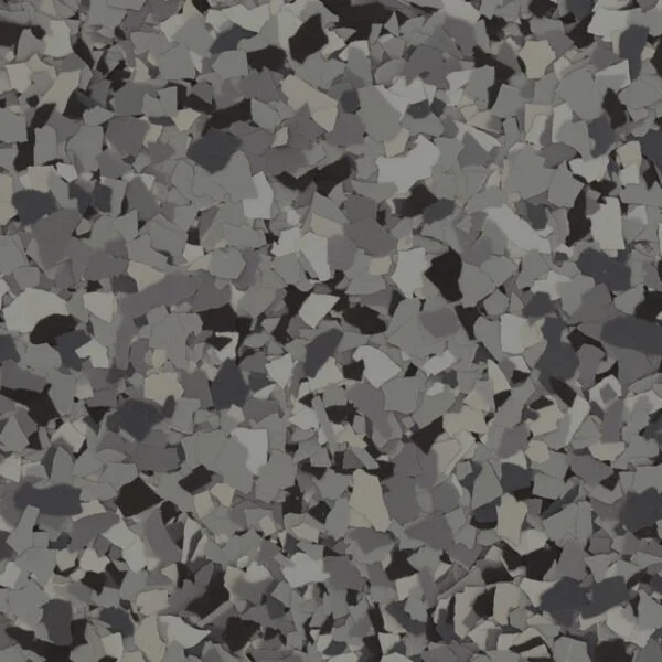 Close-up of a surface covered with small, irregularly shaped gray, black, and white stones or gravel.