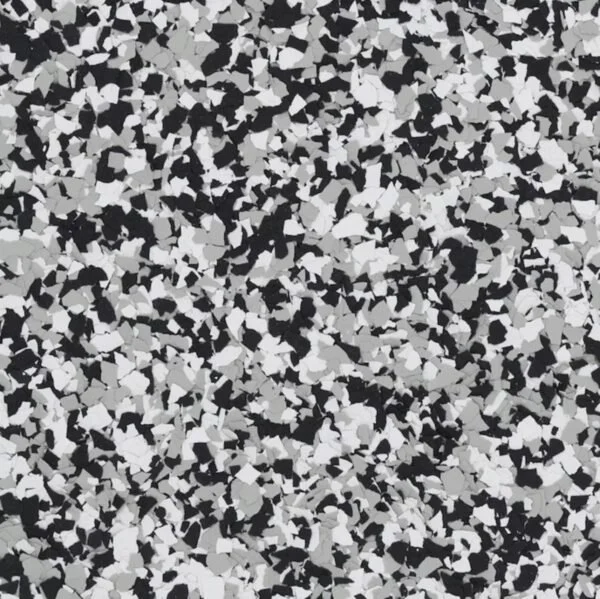 Close-up of a black, white, and gray speckled textured surface, likely used as a flooring material.