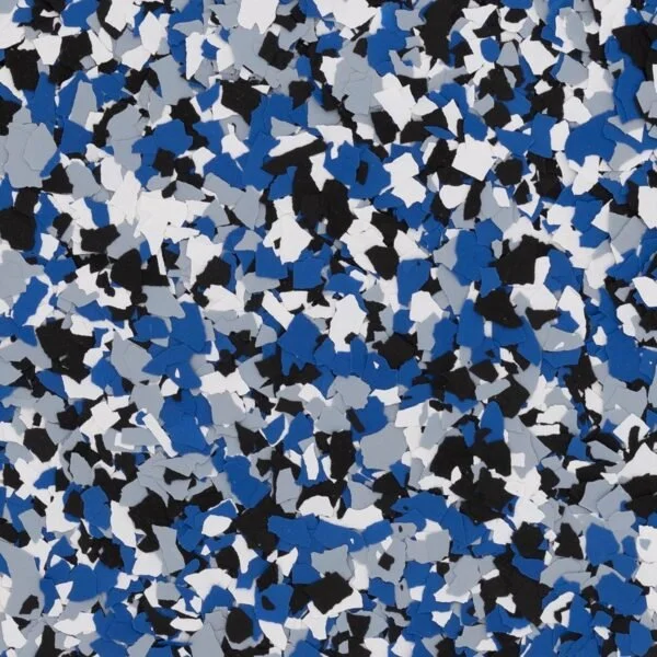 A close-up image of speckled blue, black, white, and gray spray paint confetti particles.