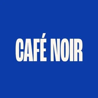 Blue sign with white text reading 'CAFÉ NOIR'.