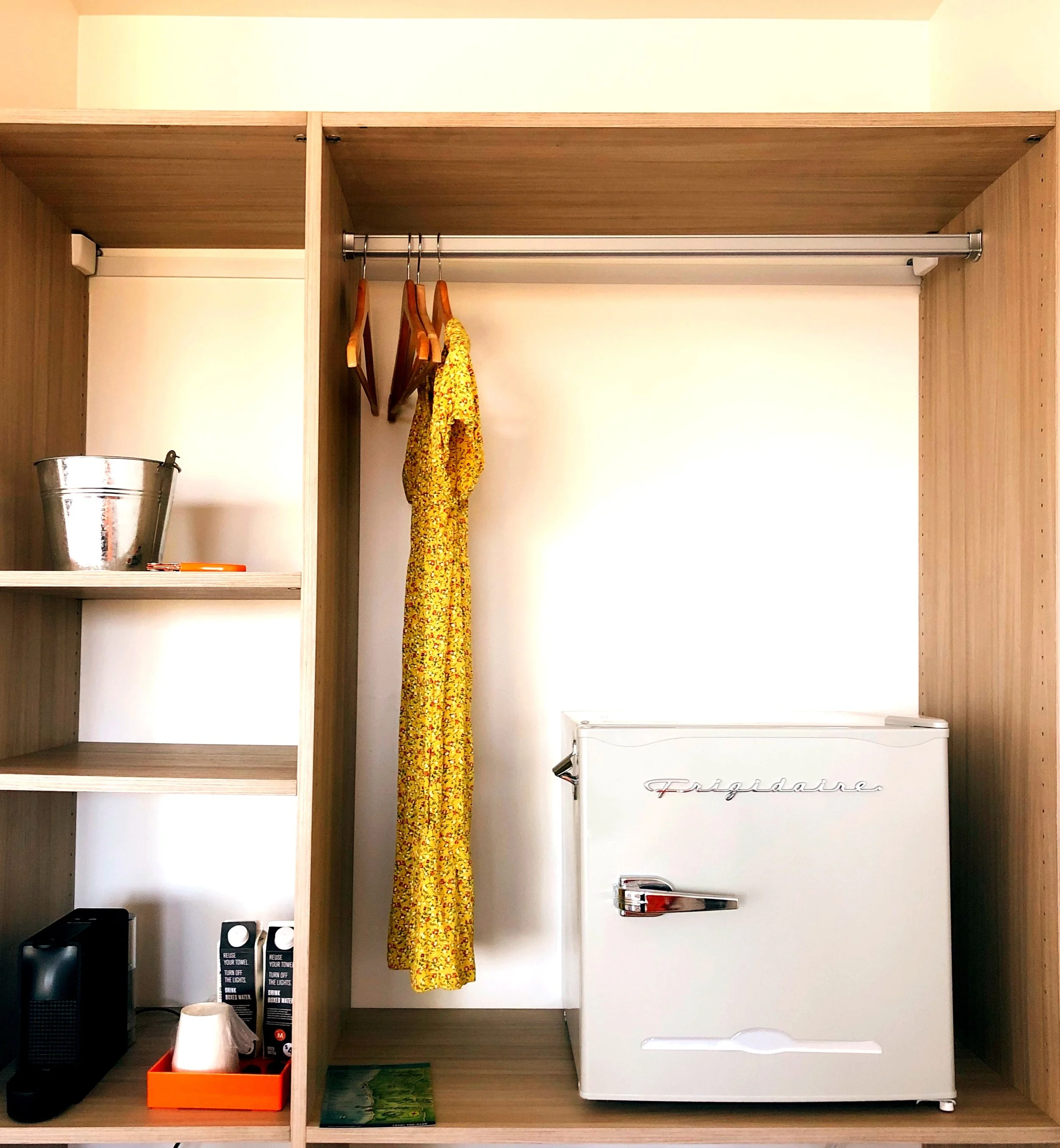 Room amenities at The Malibu Motel — Nespresso, Frigidaire mini fridge and closet