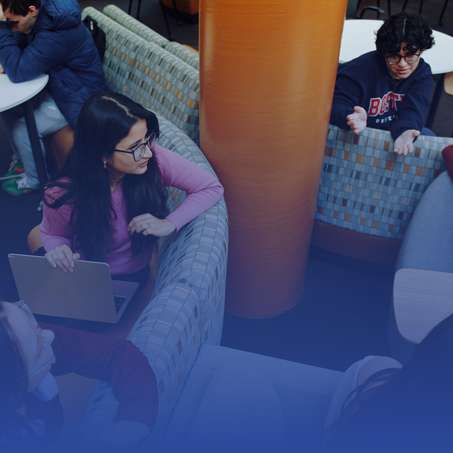 students in a library working together