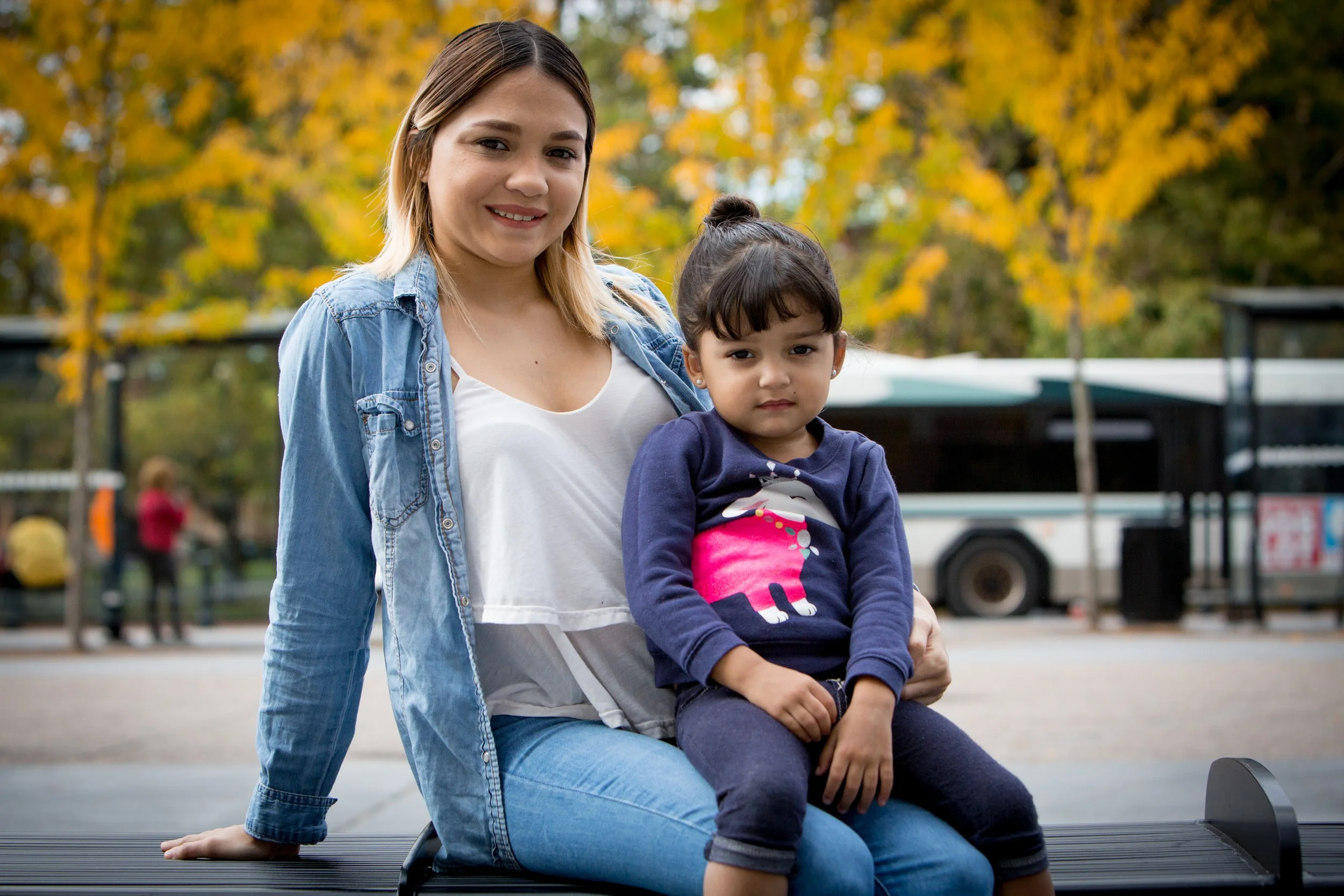 Daughter sitting on mother's lap