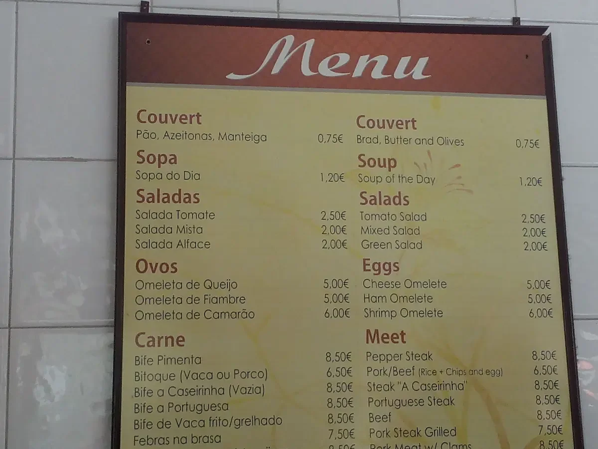 Bilingual restaurant menu with translation errors