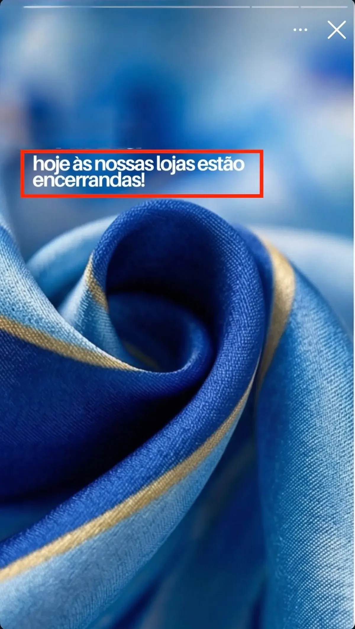 Rolled fabric in various shades of blue with a golden section