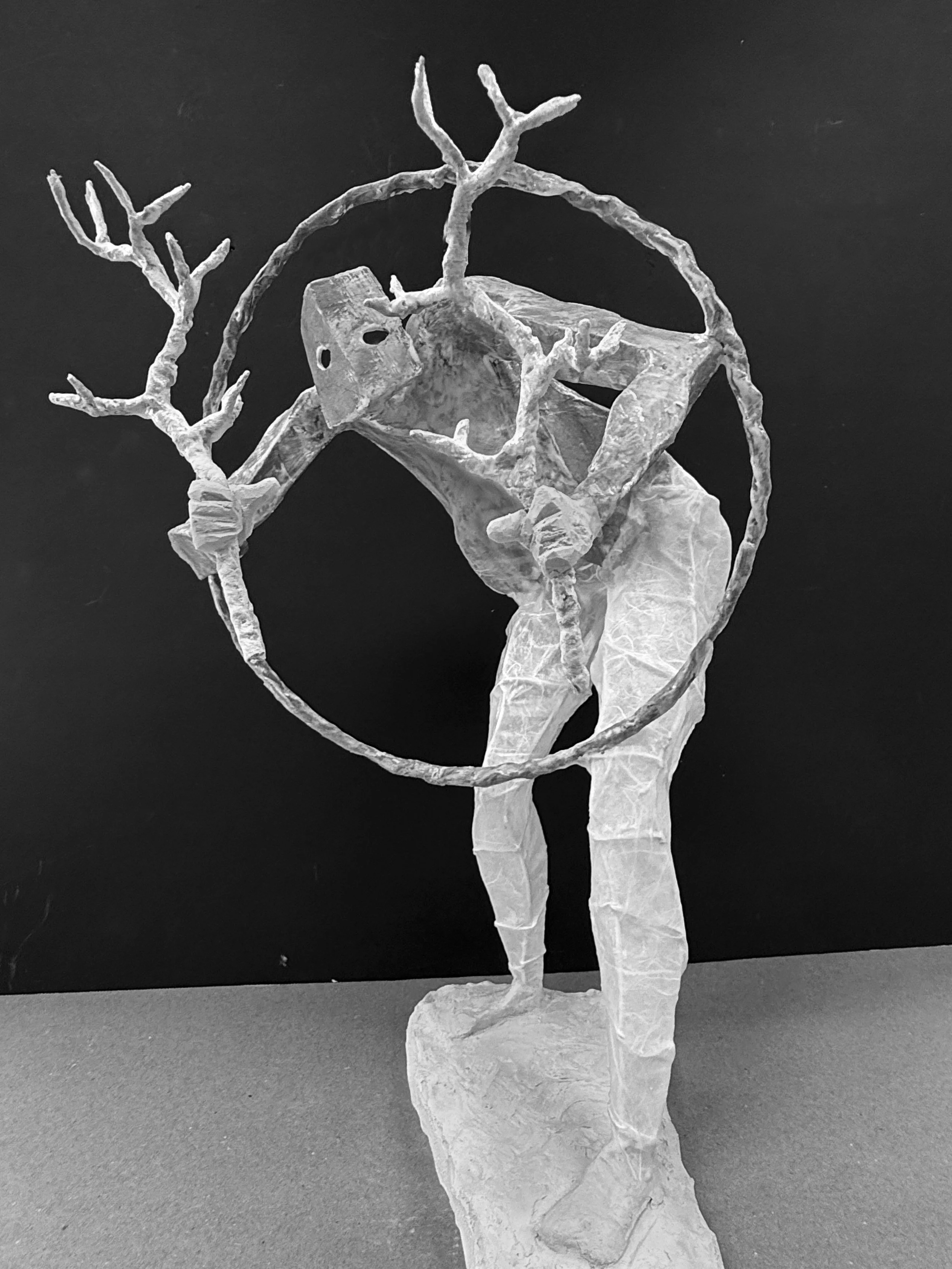 The completed figure with semi-translucent legs and opaque upper body is mounted onto a marble base and ready to paint..