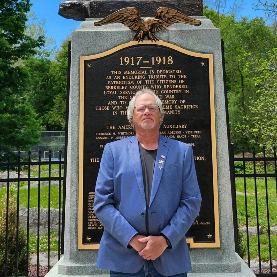 Brad Noll Standing in front of World War I "Doughboy" statue in Martinsburg's War Memorial Park