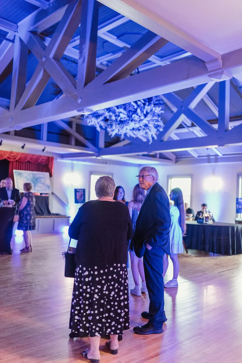 casa-blueprint-of-hope-2026-guests-mingling-blue-light-wide.webp