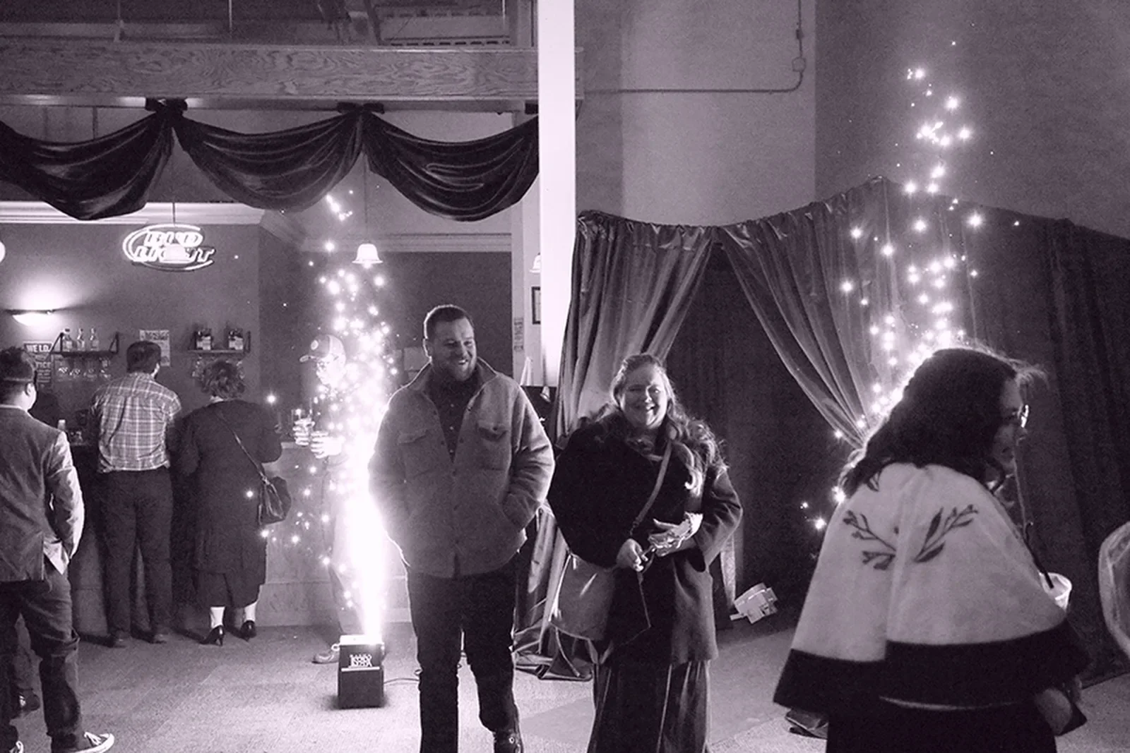 aqua-christmas-masquerade-2022-candid-grand-entrance-with-sparklers-couple-alt.webp