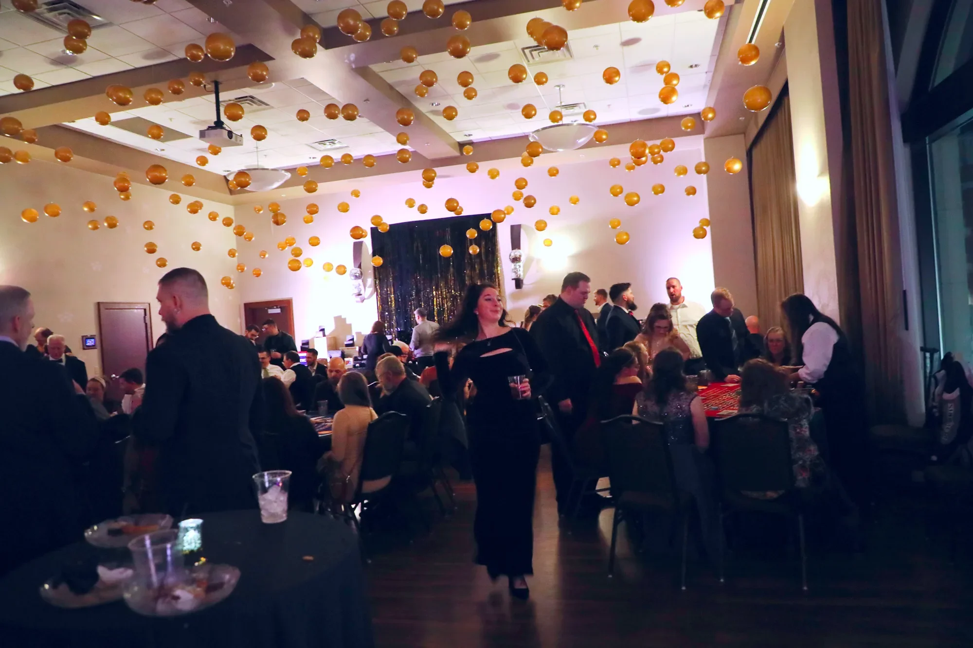 aqua-new-years-gala-2025-guests-mingling-program-evening.webp