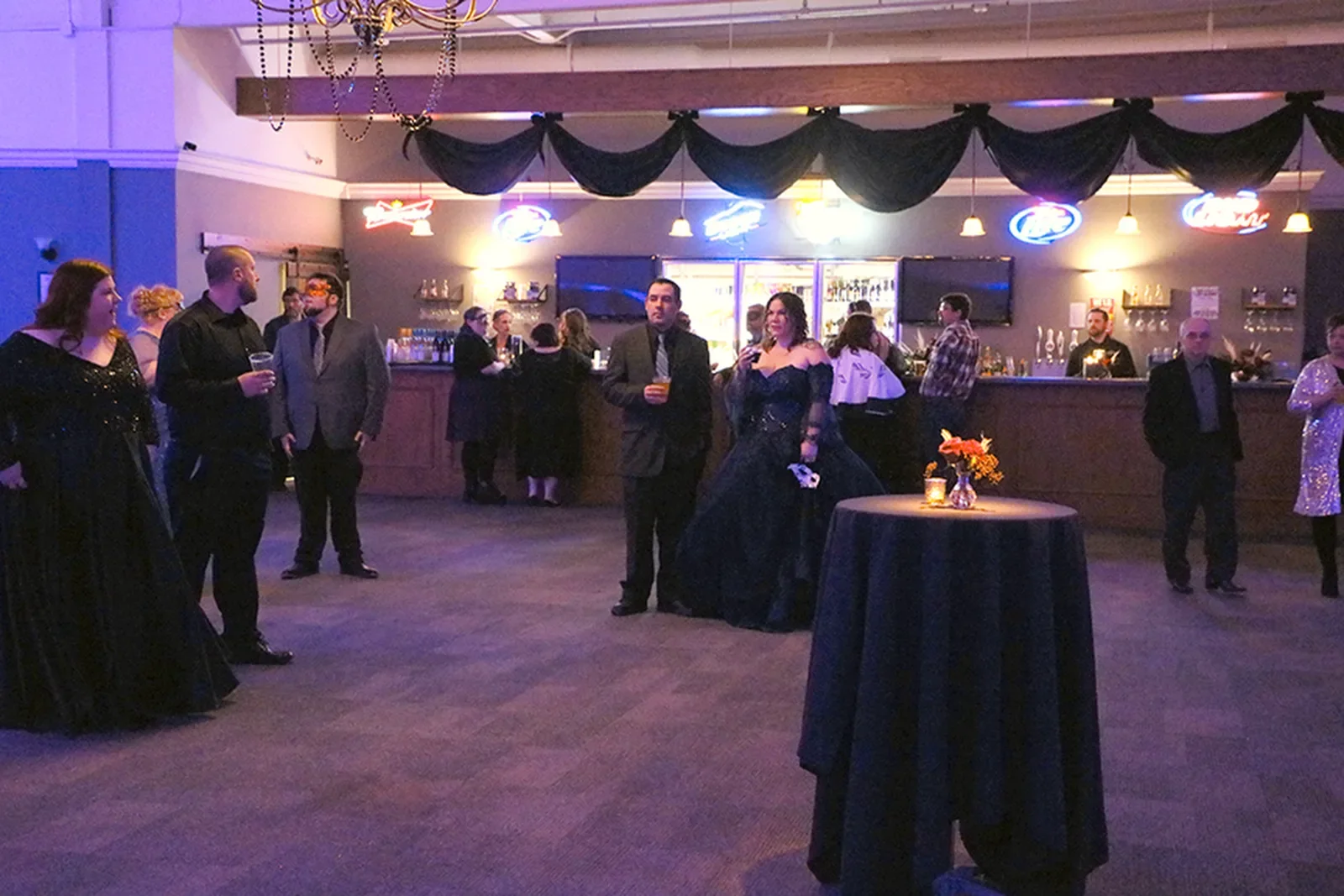 aqua-christmas-masquerade-2022-candid-grand-entrance-couple-sparklers-02.webp
