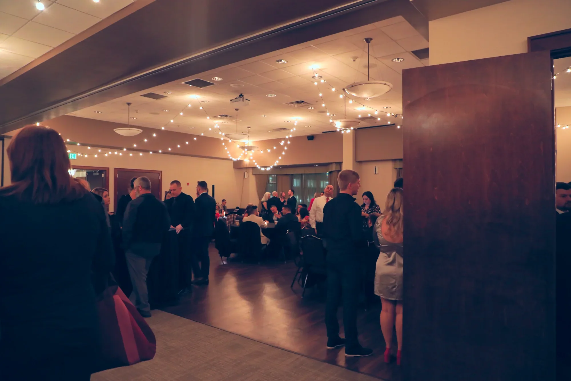 aqua-new-years-gala-2025-guests-cocktail-hour-mingling-01.webp