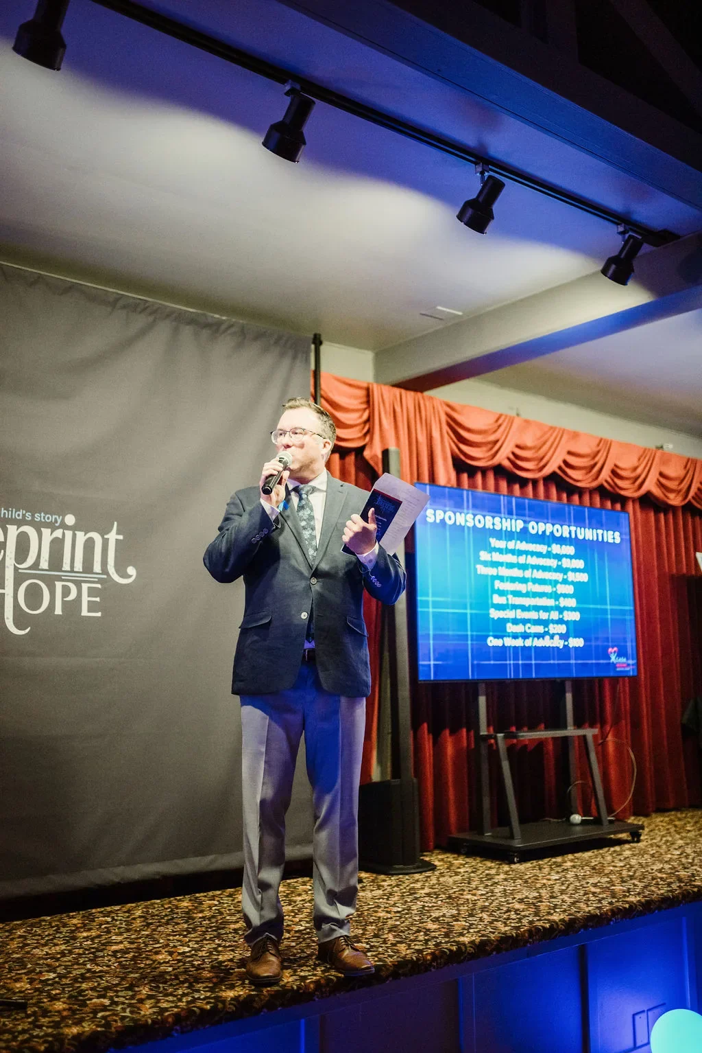 casa-blueprint-of-hope-2026-speaker-at-podium-program-02.webp