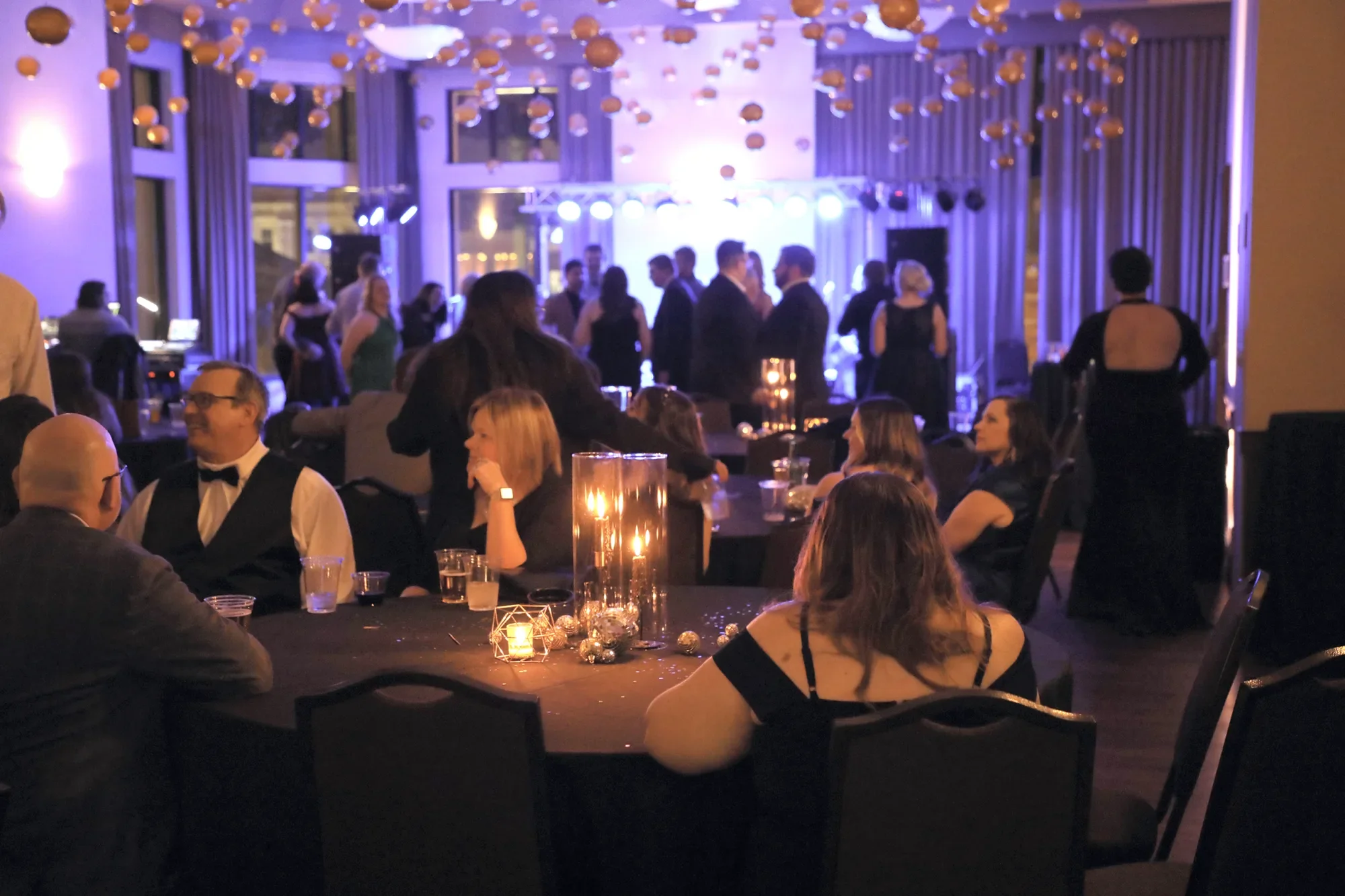aqua-new-years-gala-2025-guests-pink-uplit-mingling-late.webp