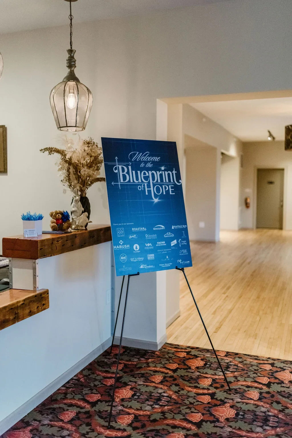 casa-blueprint-of-hope-2026-registration-welcome-sign-easel.webp