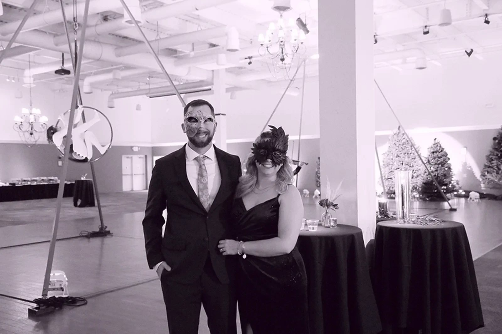 aqua-christmas-masquerade-2022-candid-grand-entrance-couple-walking-alt.webp