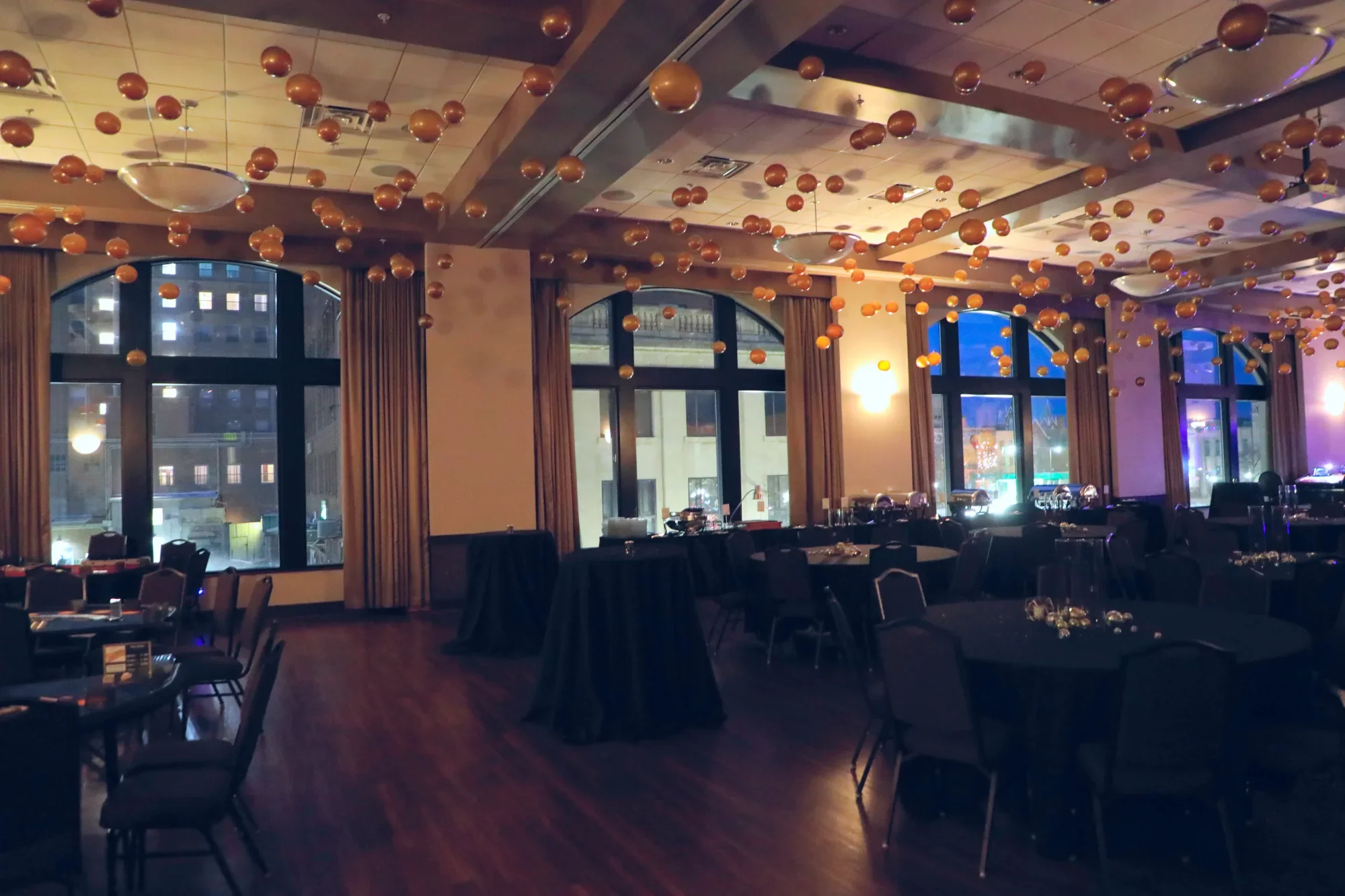 aqua-new-years-gala-2025-venue-setup-arched-windows-ballroom.webp