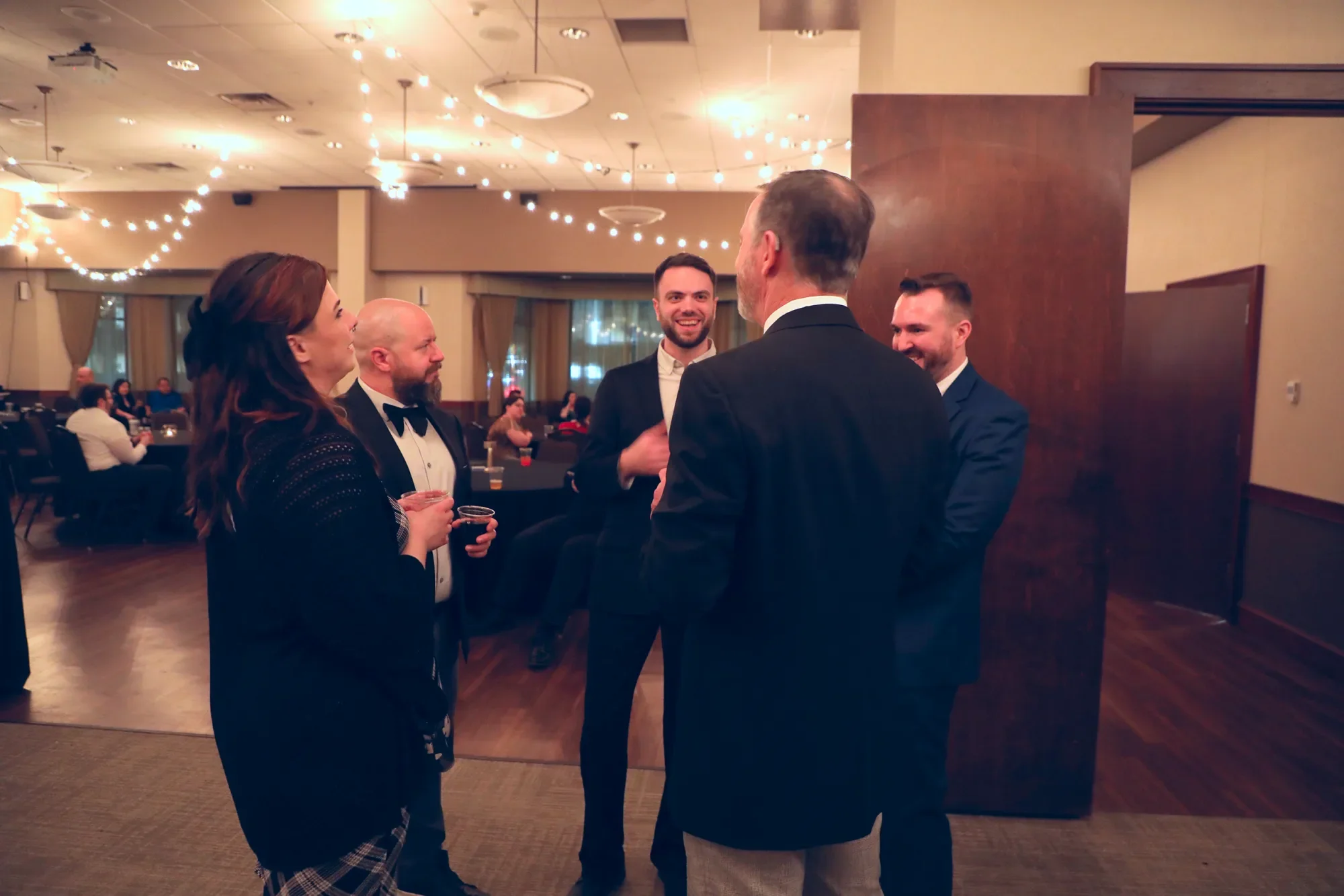 aqua-new-years-gala-2025-guests-friends-portrait-late-evening.webp