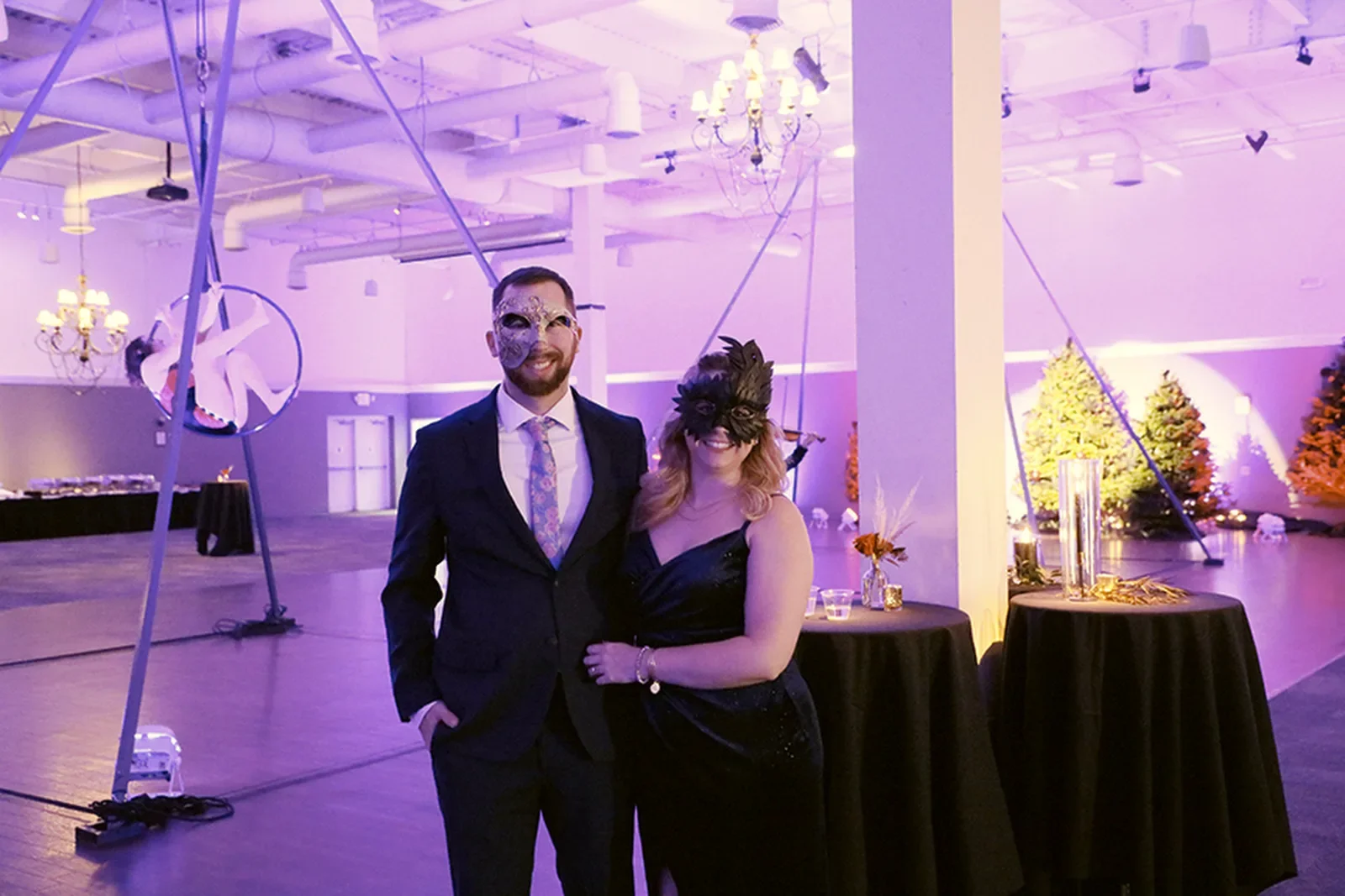 aqua-christmas-masquerade-2022-candid-grand-entrance-couple-walking.webp