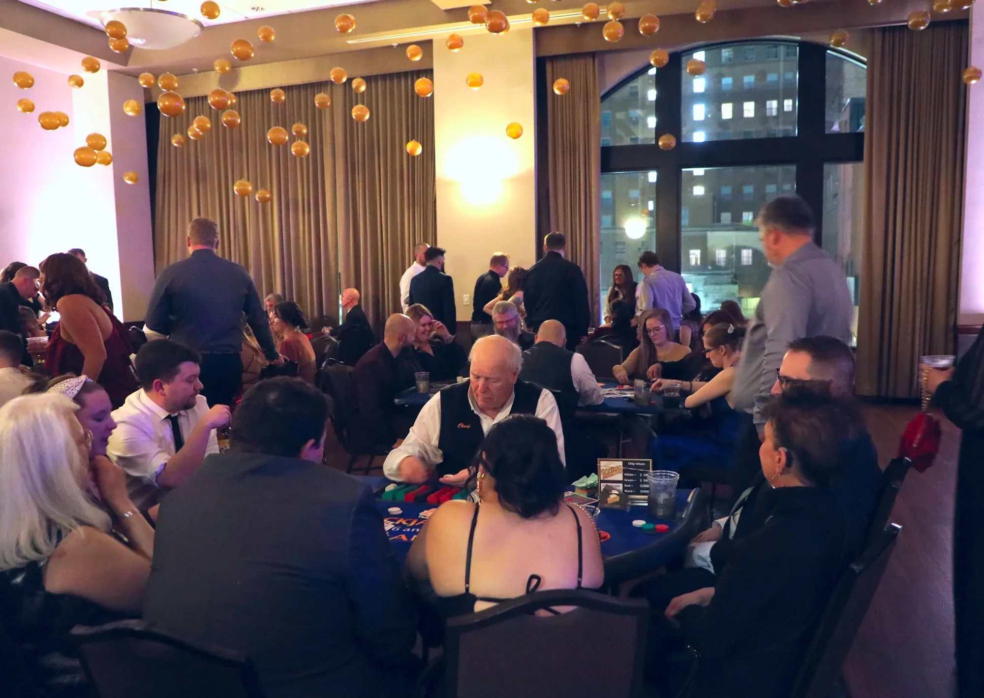 aqua-new-years-gala-2025-guests-mingling-late-night-conversation.webp