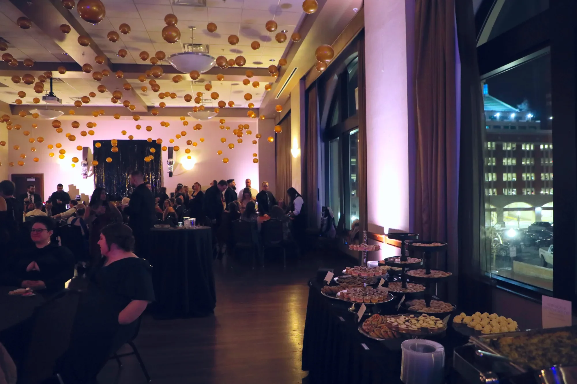 aqua-new-years-gala-2025-venue-setup-pink-uplit-empty-room.webp