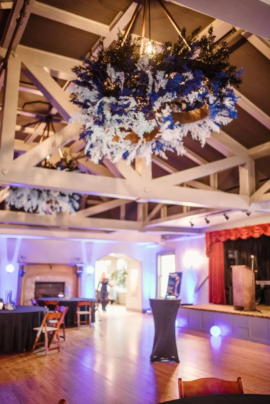 casa-blueprint-of-hope-2026-tablescape-blue-florals-candles-overhead.webp