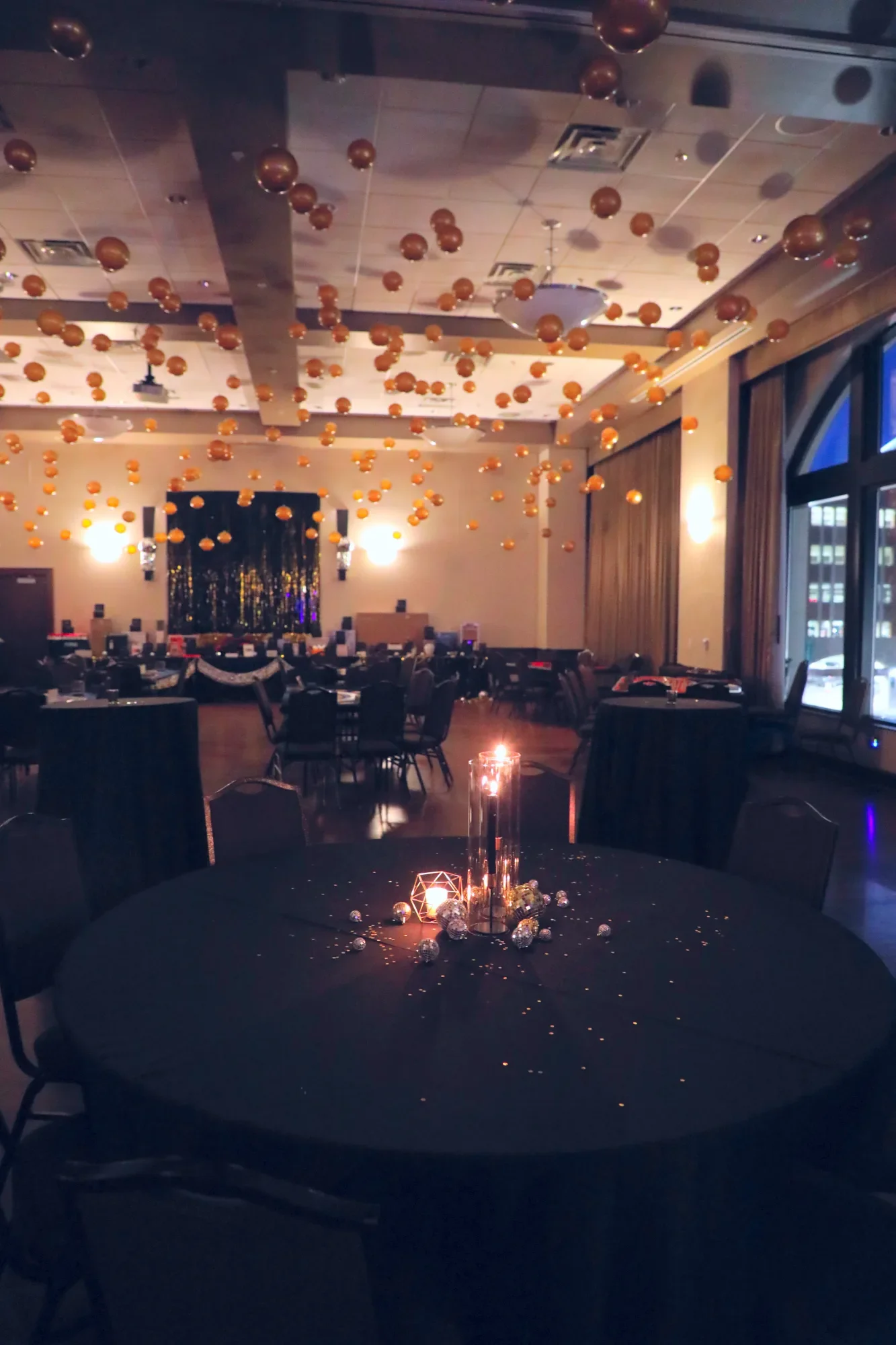 aqua-new-years-gala-2025-venue-setup-cocktail-tables-evening-detail.webp
