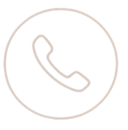 Icon of a phone receiver inside a circle, representing a call or phone function.