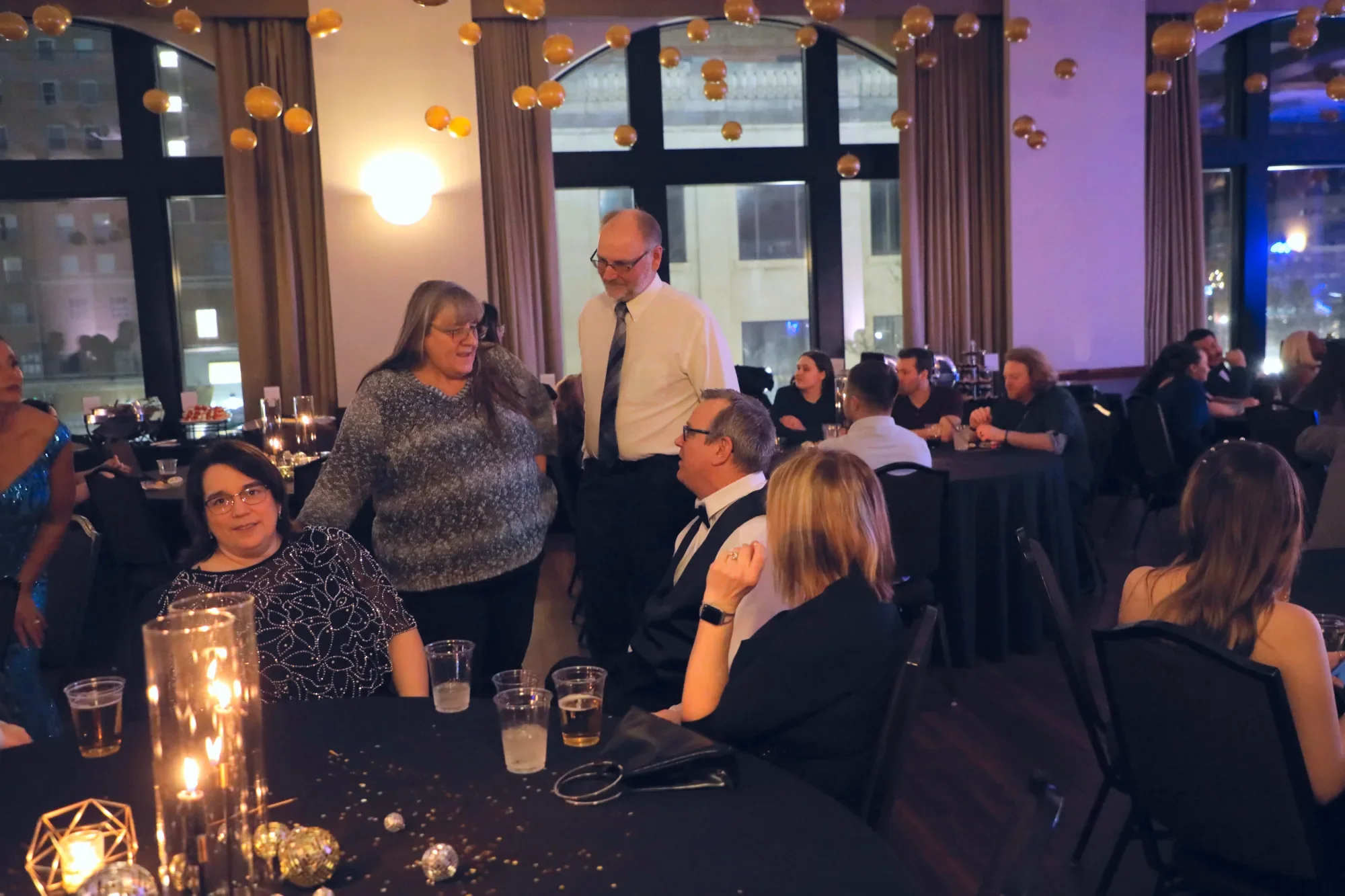 aqua-new-years-gala-2025-guests-dancing-friends-group.webp
