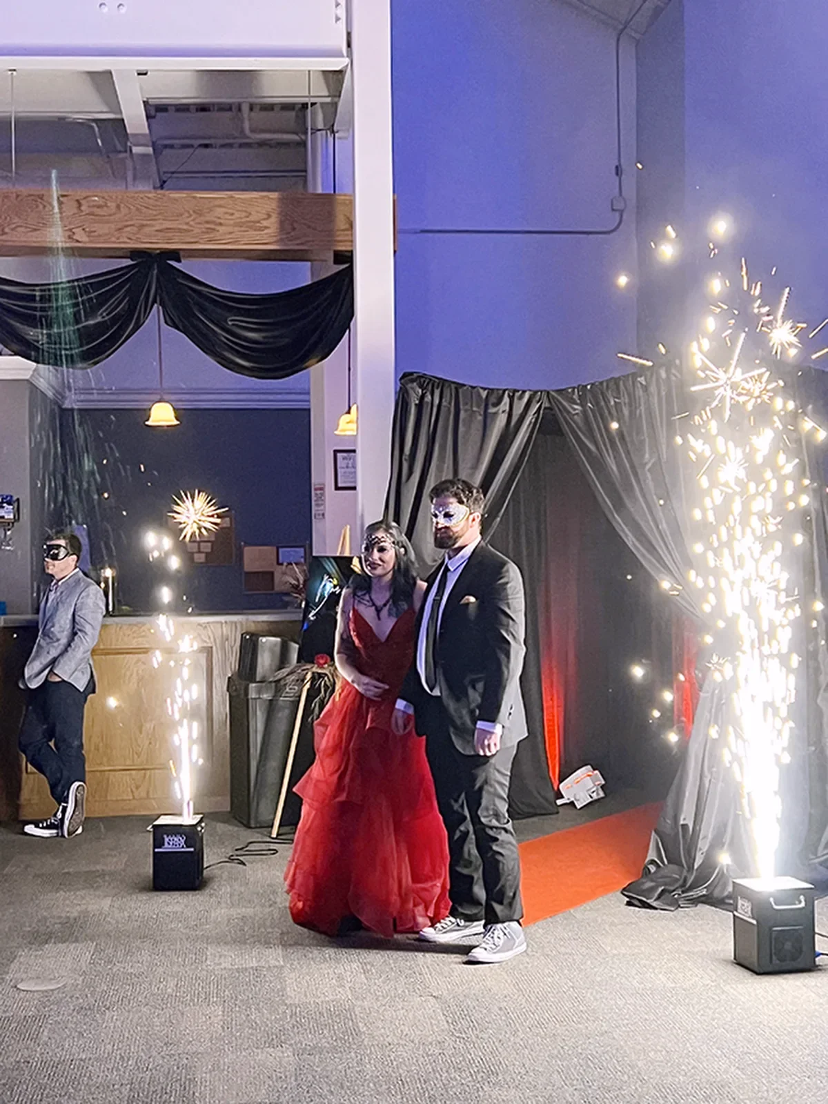 aqua-christmas-masquerade-2022-candid-iphone-grand-entrance-with-sparklers.webp