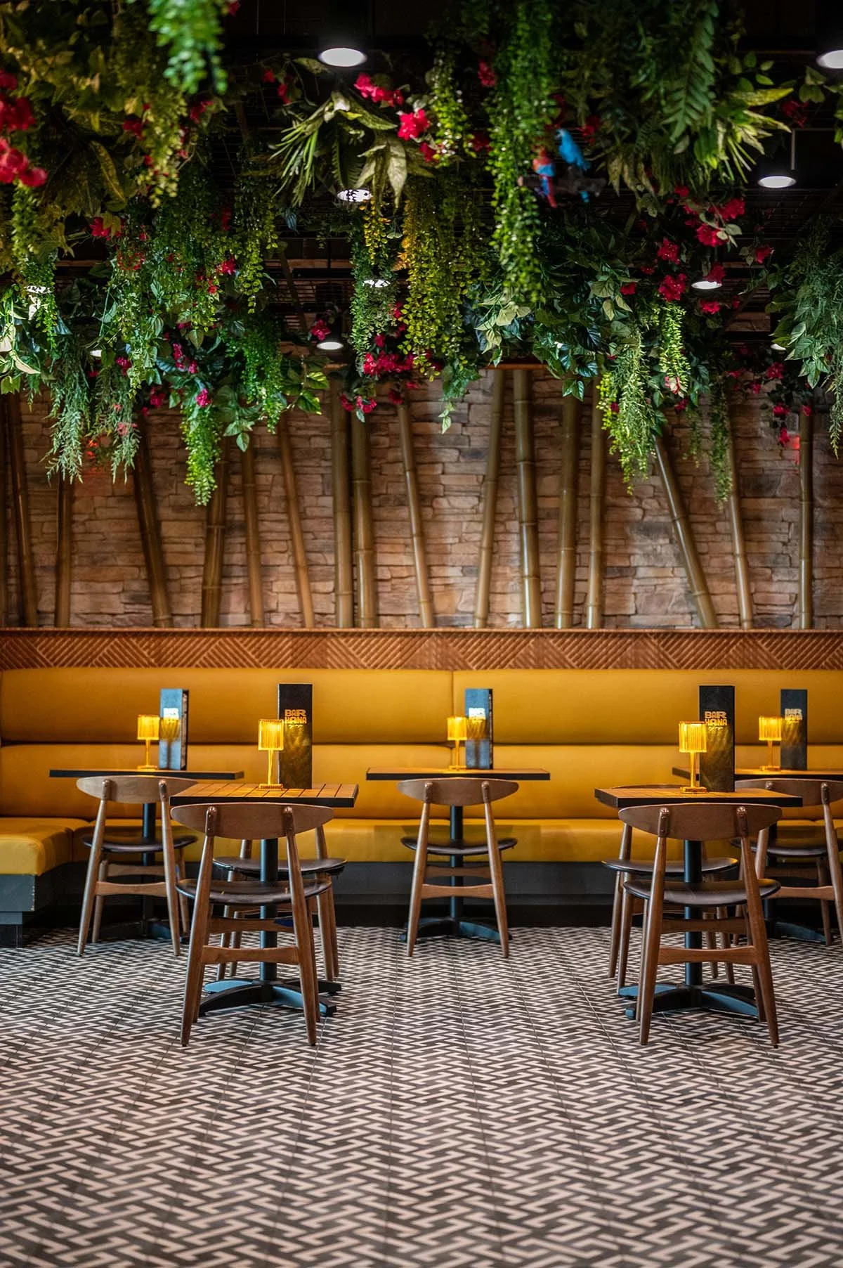 tropical bar+yellow booths+greenery+bar+bamboo poles.jpg
