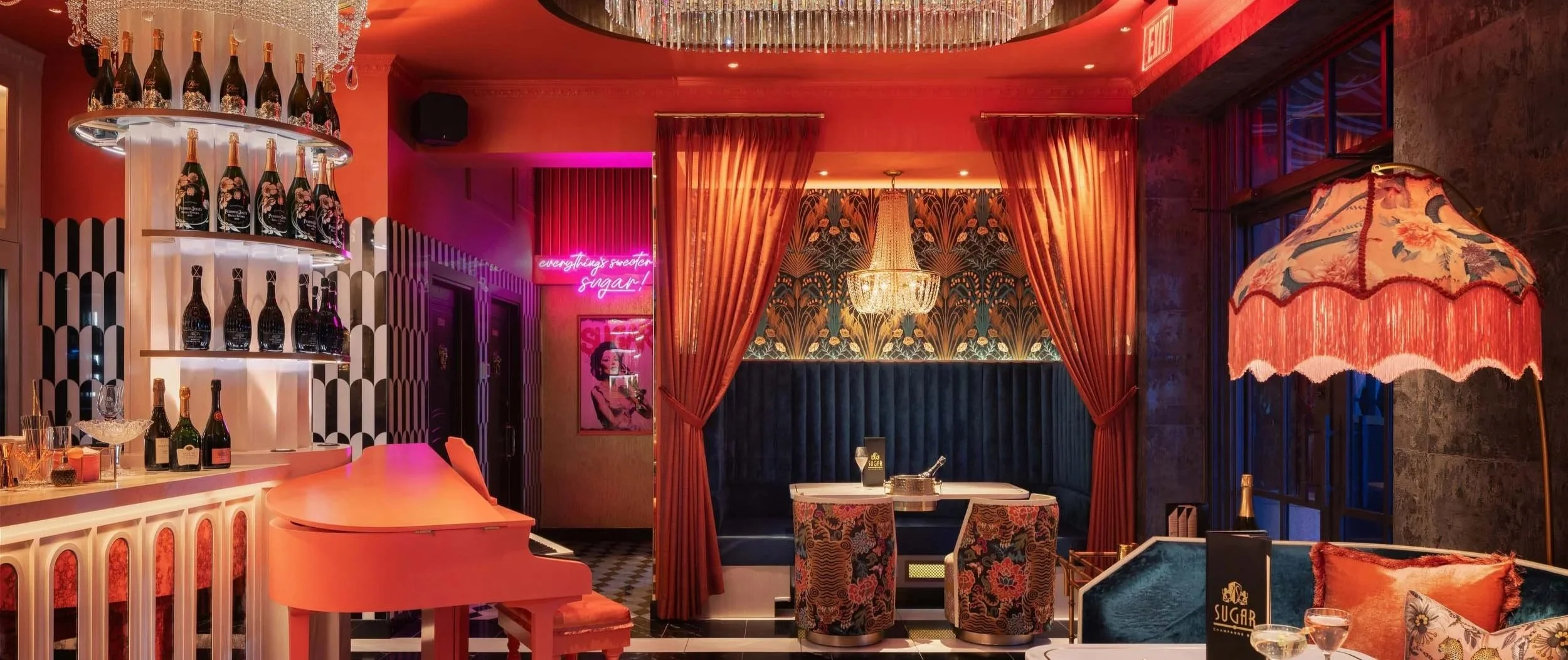 pink+pink piano+chandeliers+bar design+black and white floor.jpg