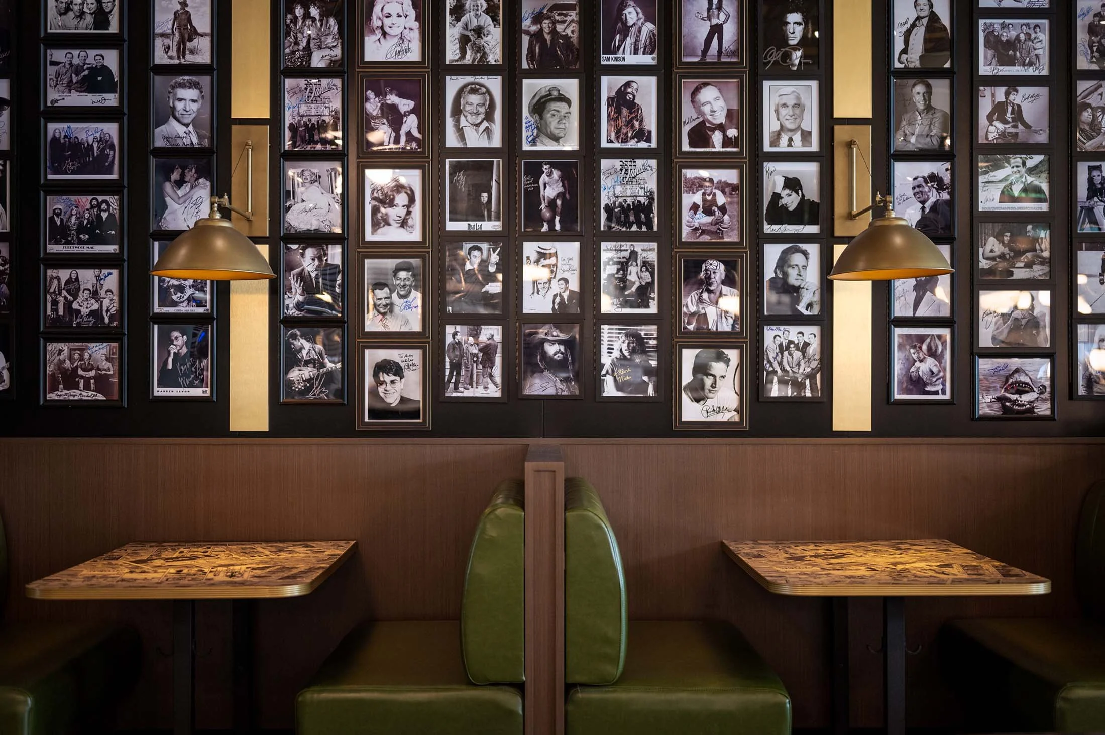 black and white photos+wall sconce+booth seating.jpg