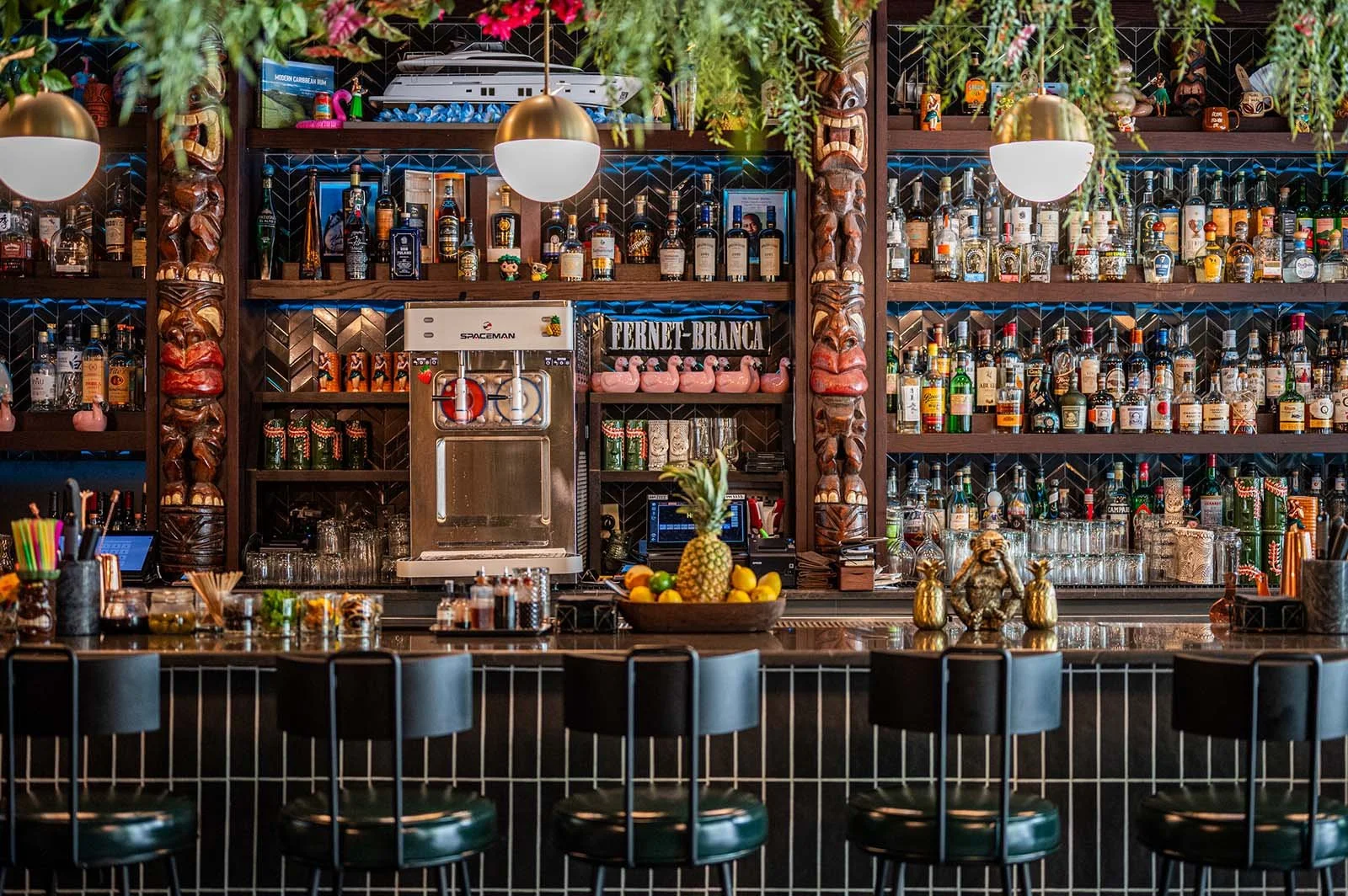 tiki bar+totem poles+globe lights+bar+back bar.jpg
