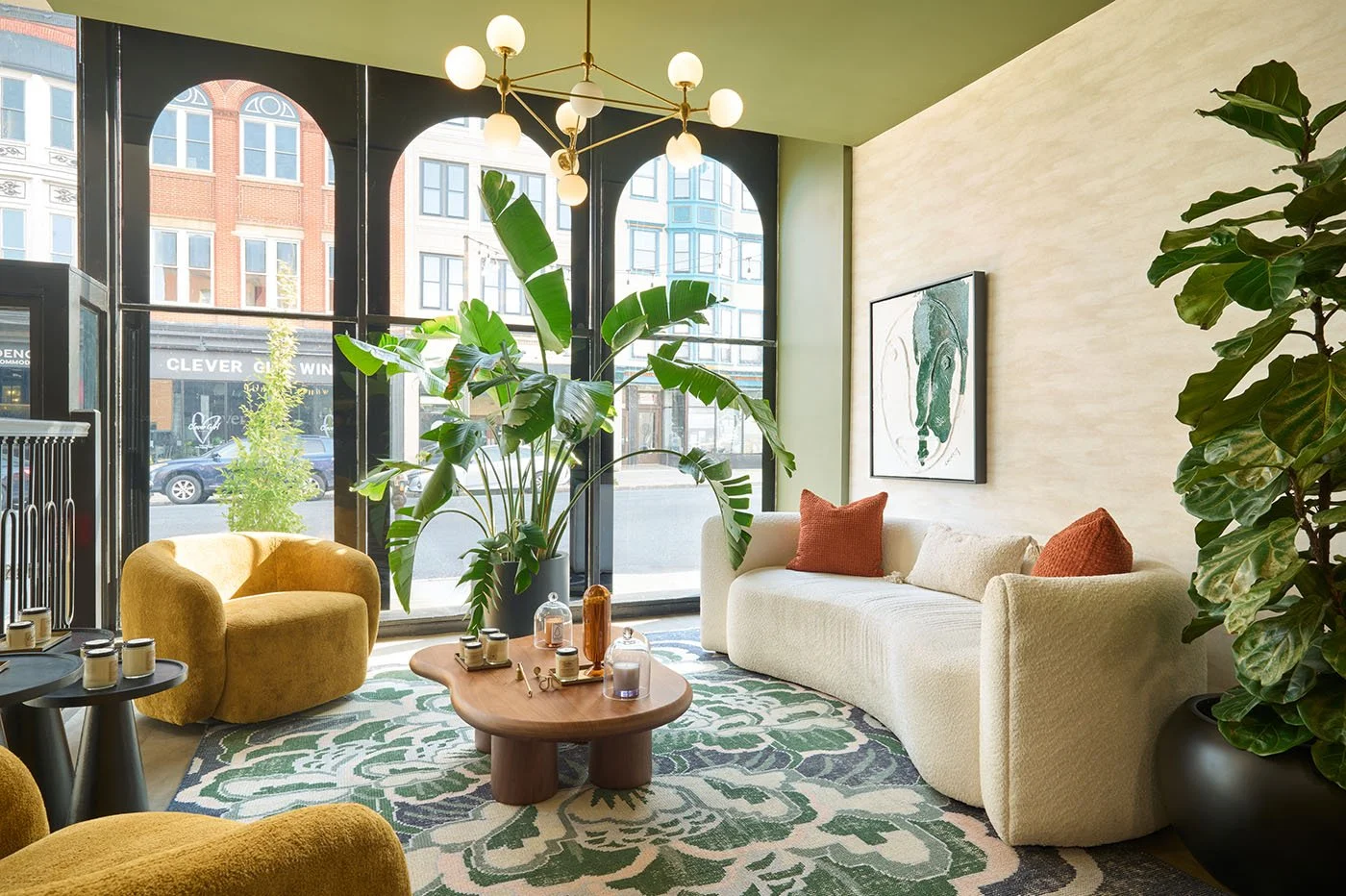 sitting area+retail lounge+plants+yellow chairs.jpg