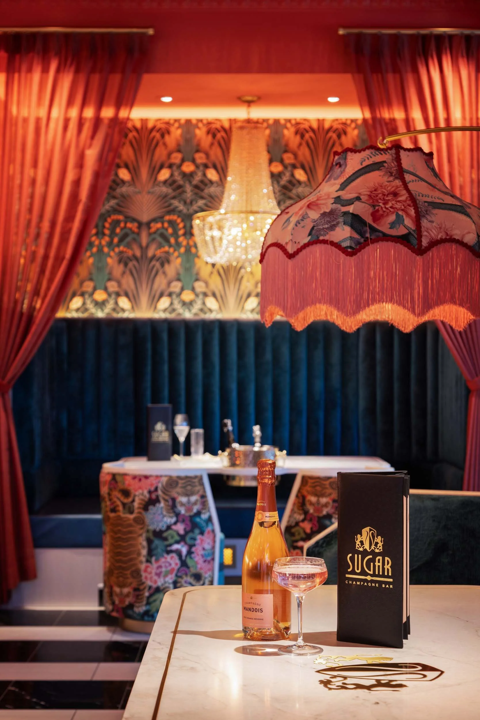 lamp shade+champagne+chandelier+teal booth+restaurant booth+sugar.jpg