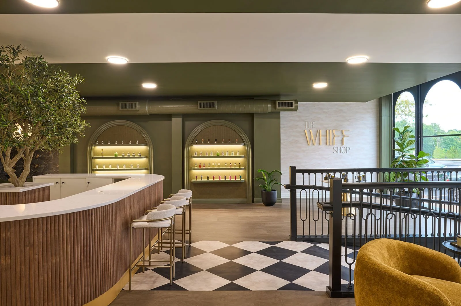 retail store+green walls+arches+yellow chair.jpg