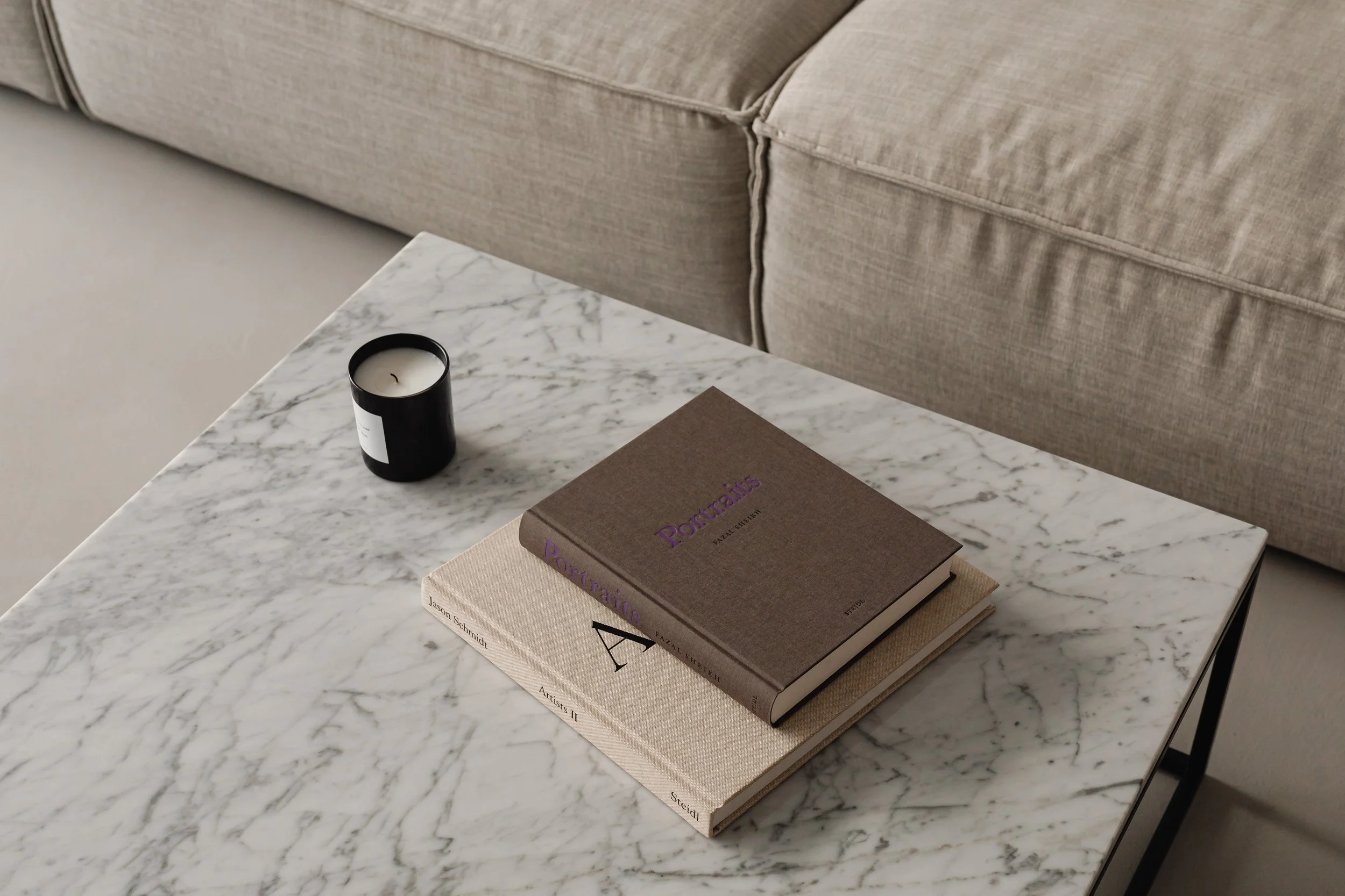 kaboompics_living-room-gray-beige-sofa-marble-coffee-table-coffee-table-books-candle-29393.jpg