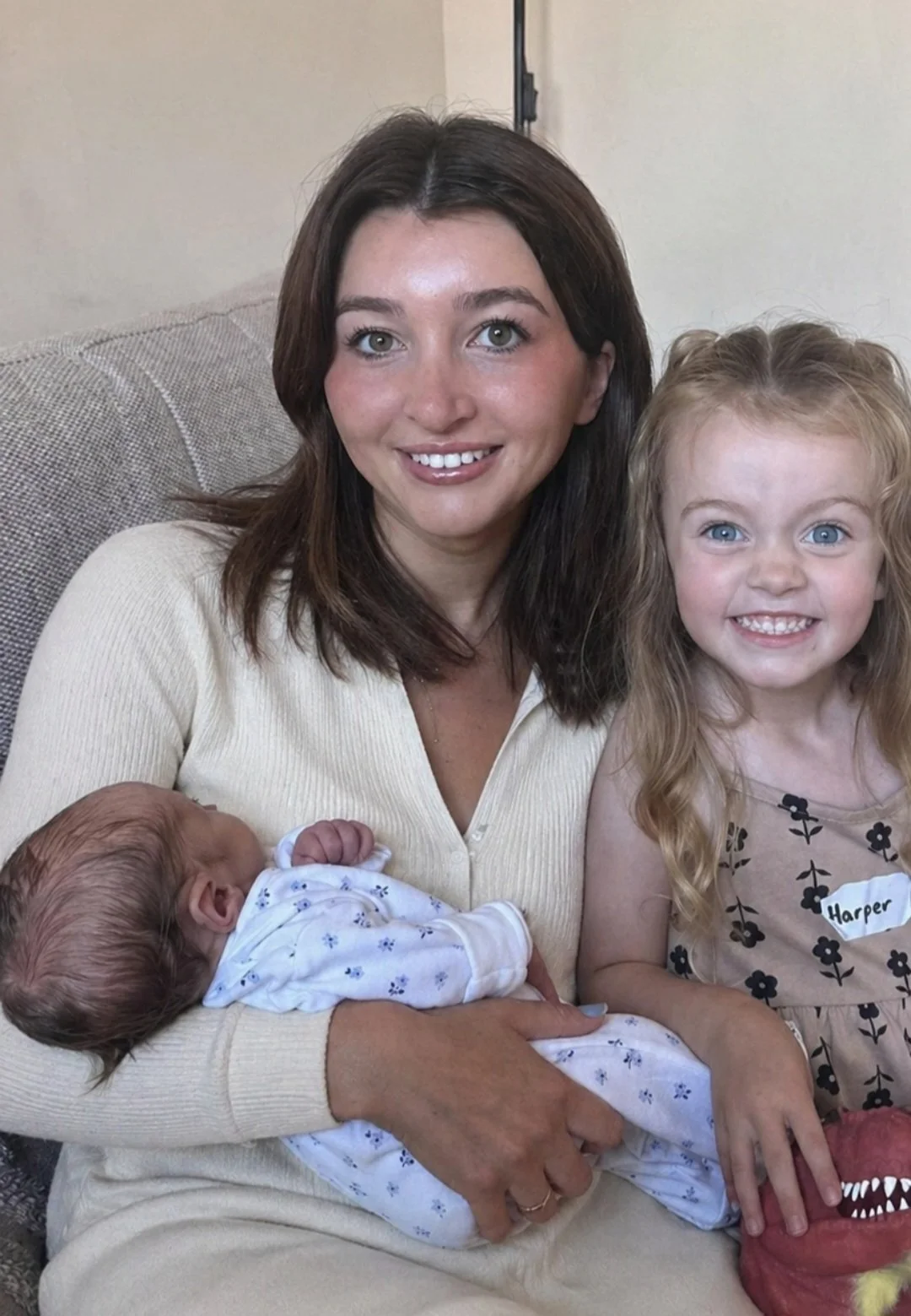 certified sleep consultant Emma holding a newborn and toddler, showing gentle, experienced childcare and baby sleep support