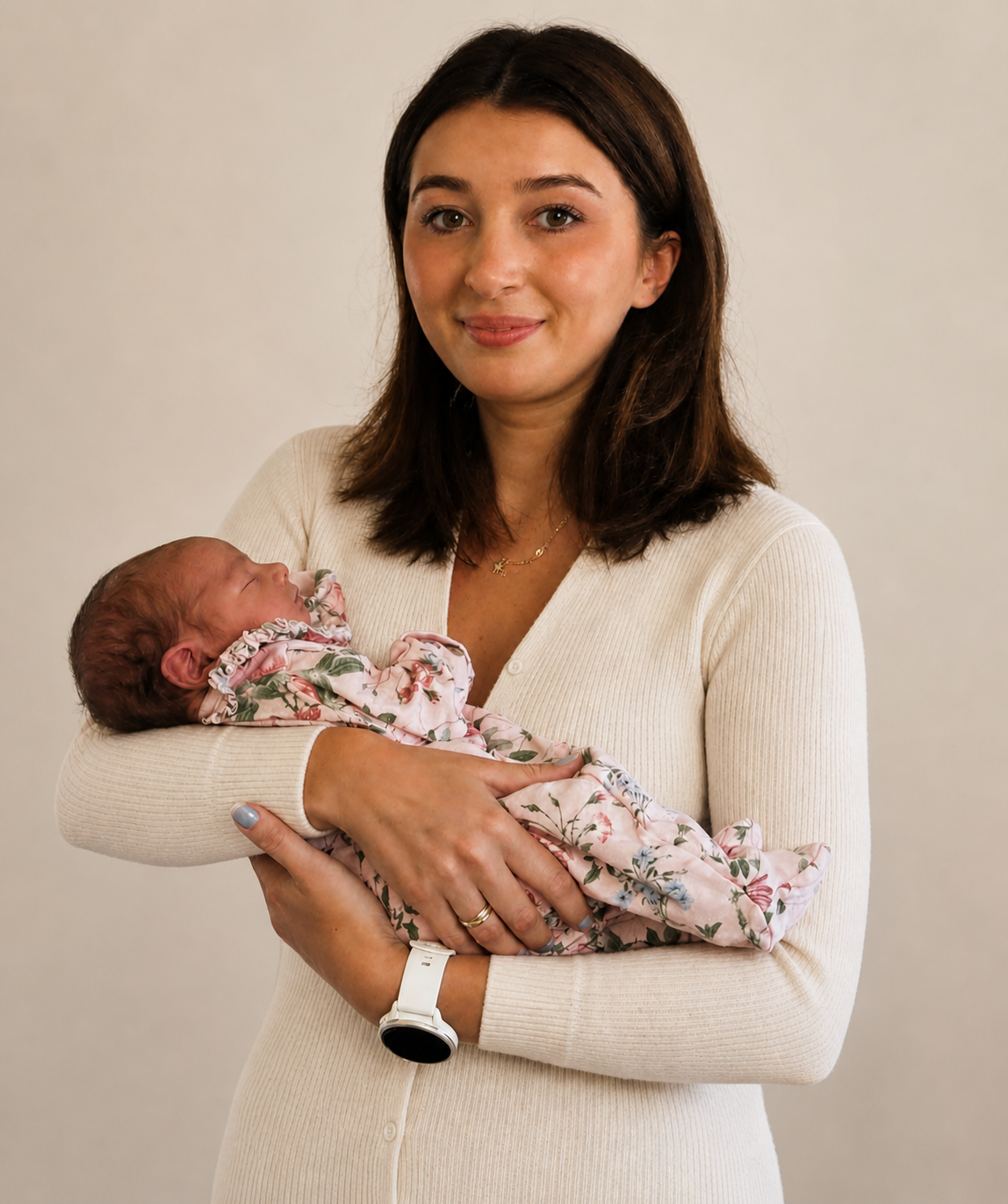 Gentle sleep consultant holding a sleep newborn, showing, calm supported bedtime and responsive sleep guidance for babies.