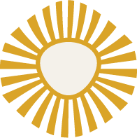 A circular design with a white center and gold rays extending outward, resembling a sunburst pattern.