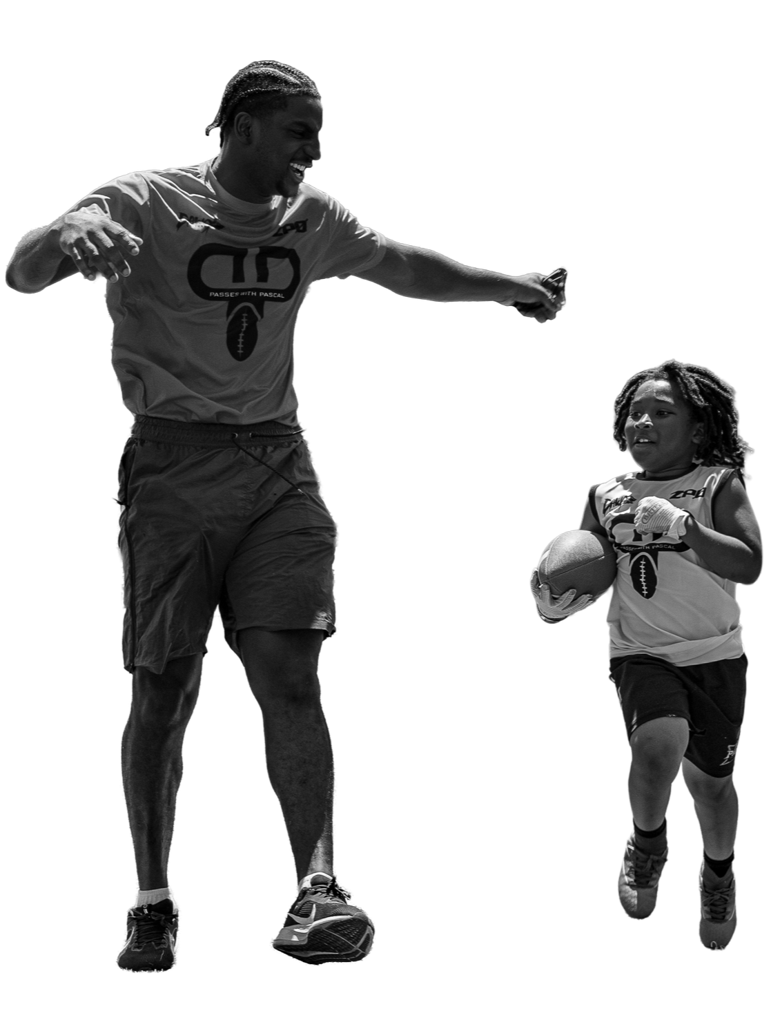 A man and a young girl playing football together. The man is smiling and reaching out to the girl, who is holding a football and looking ahead.