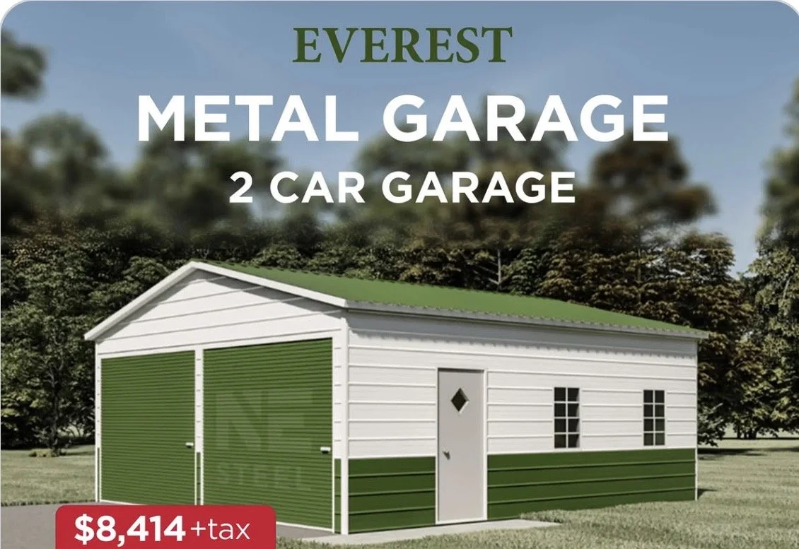A white and green metal garage with two doors and a side door, situated on grass with trees in the background. Text indicates it's an Everest 2-car garage costing $8,414 plus tax.